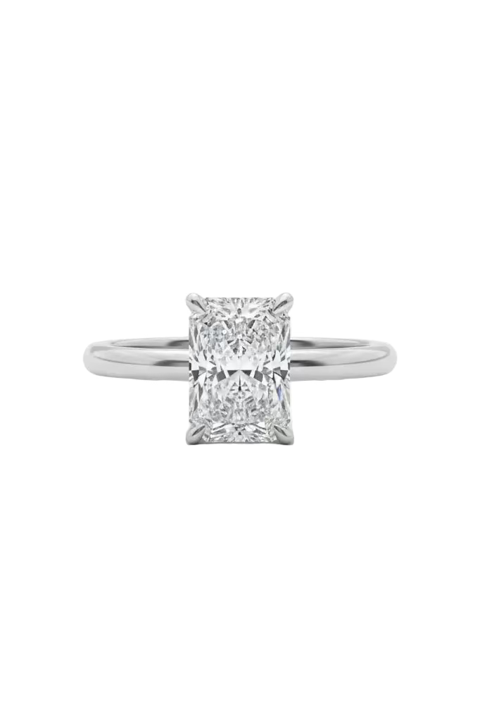 Diamond ring on a white surface